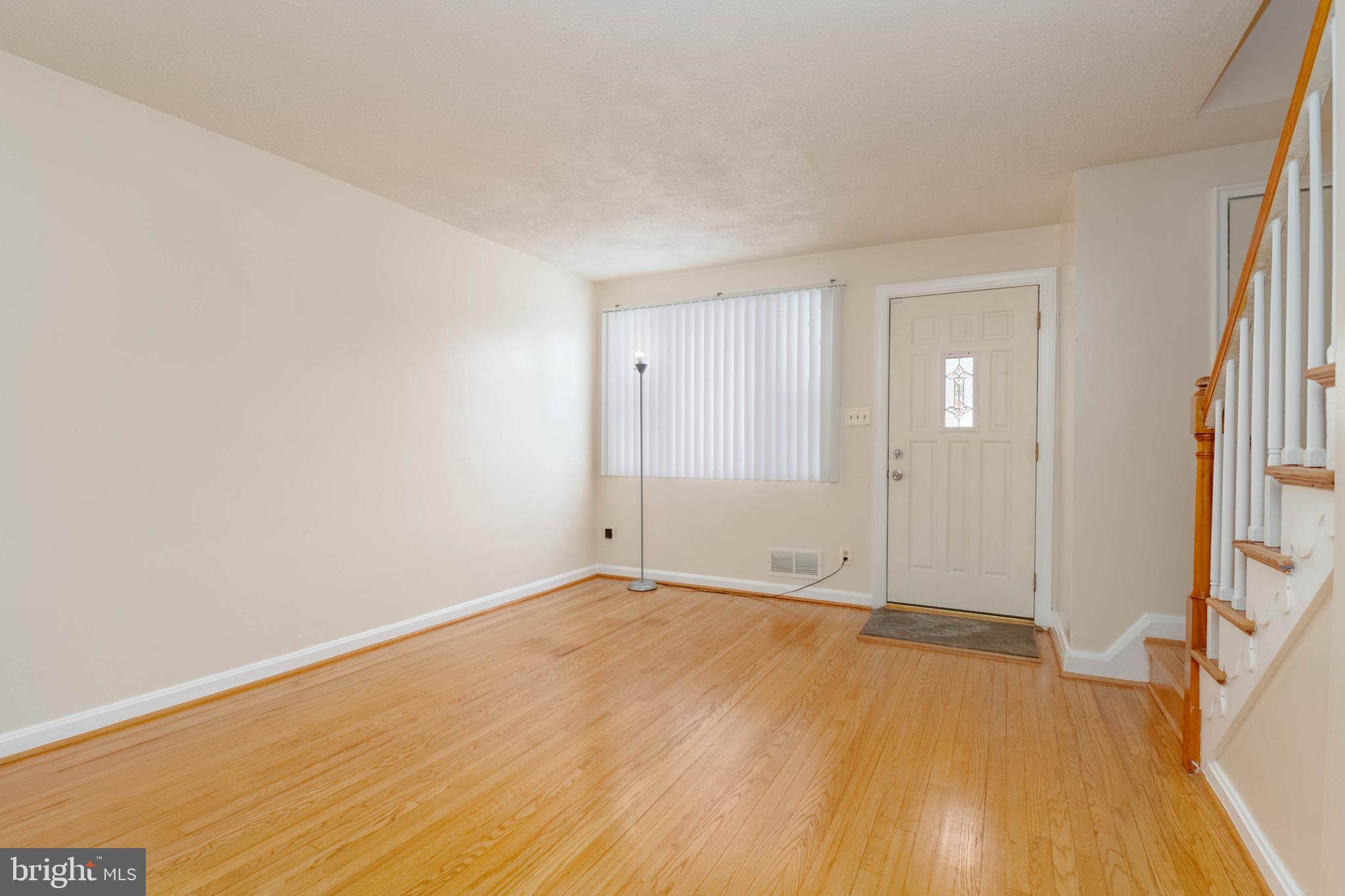 5413 Channing Road Baltimore, MD 21229 - Photo 5 of 45 a view of an empty room and wooden floor