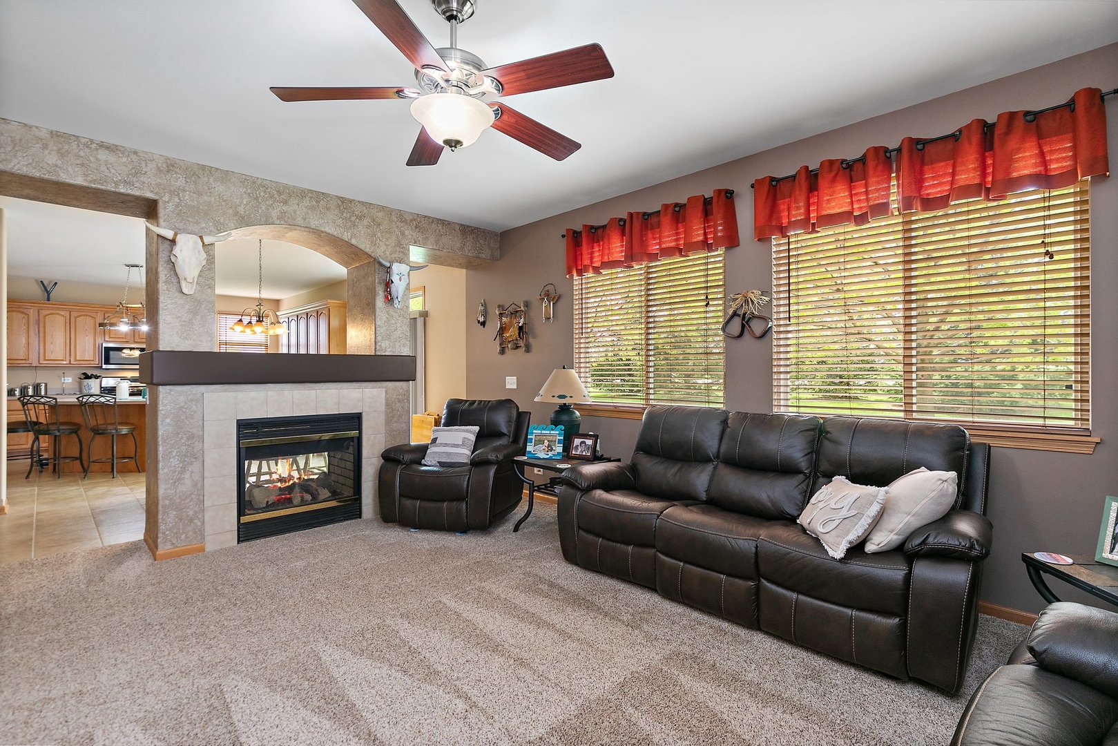 244 Prescott Avenue Elgin, IL 60124 - Photo 11 of 31 a living room with furniture a large window and a fireplace