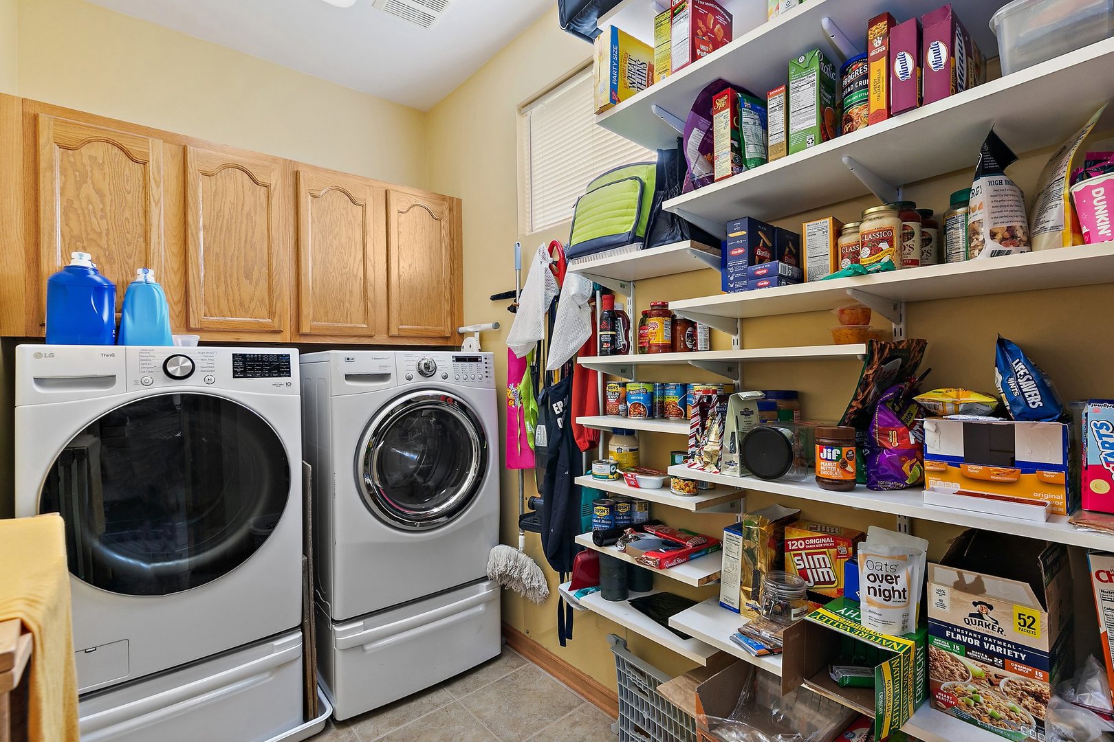 244 Prescott Avenue Elgin, IL 60124 - Photo 13 of 31 a view of walk in closet with clothes and shoes