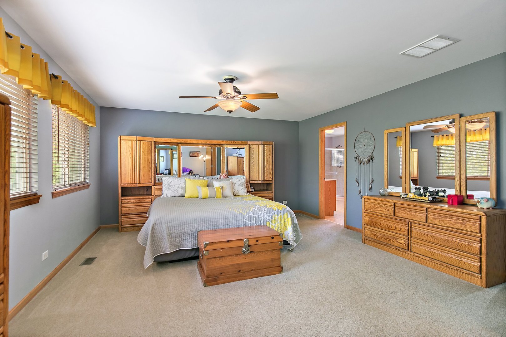 244 Prescott Avenue Elgin, IL 60124 - Photo 14 of 31 a spacious bedroom with a bed and a chandelier