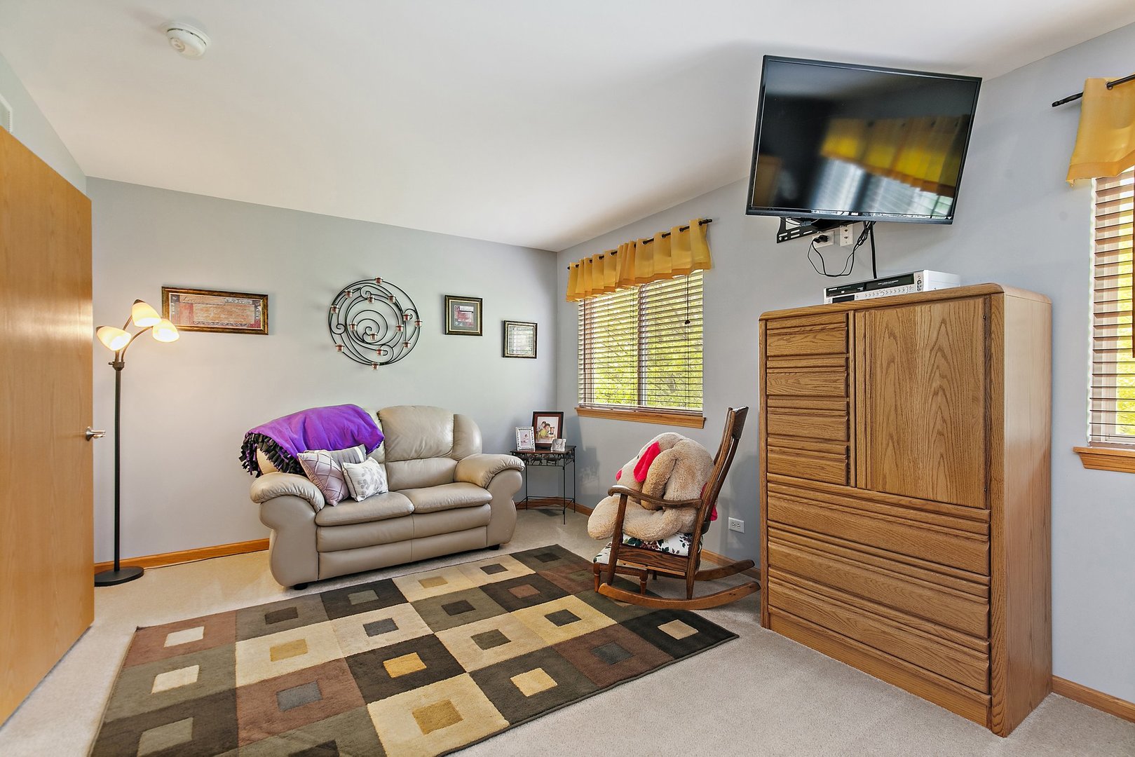 244 Prescott Avenue Elgin, IL 60124 - Photo 15 of 31 a living room with furniture and a flat screen tv