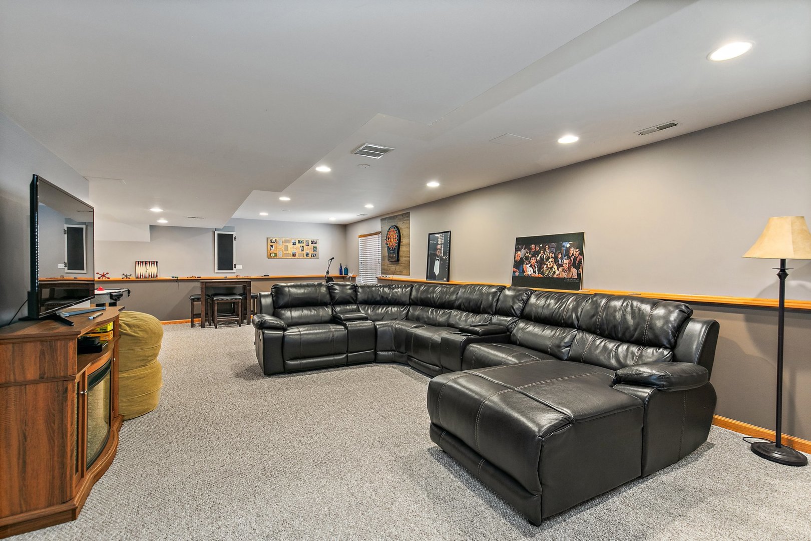 244 Prescott Avenue Elgin, IL 60124 - Photo 24 of 31 a living room with furniture and a flat screen tv