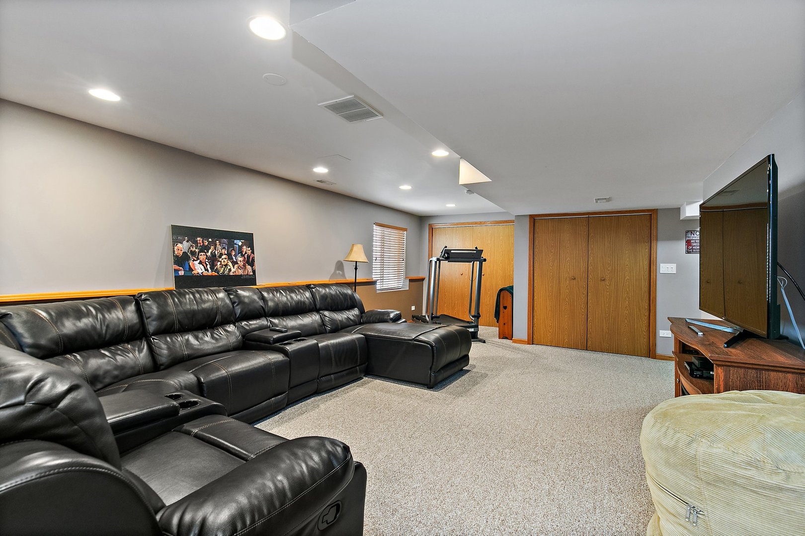 244 Prescott Avenue Elgin, IL 60124 - Photo 25 of 31 a living room with furniture and a flat screen tv