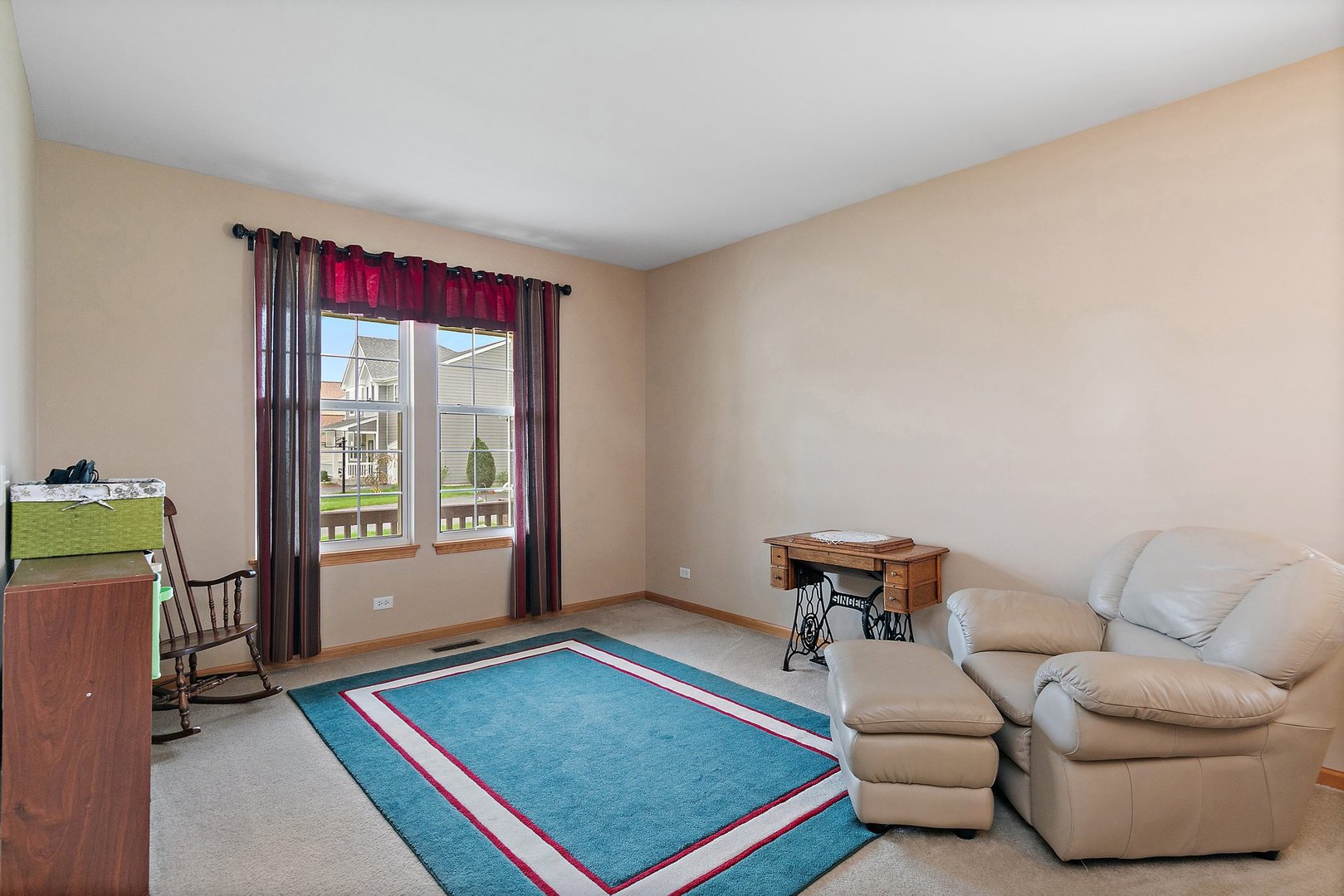 244 Prescott Avenue Elgin, IL 60124 - Photo 4 of 31 a living room with furniture and a rug