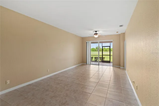 a view of a room with wooden floor and a sink