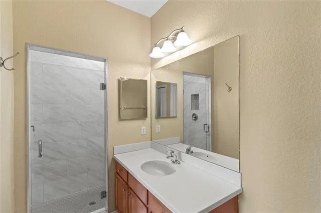 a view of a garden with a building in the background