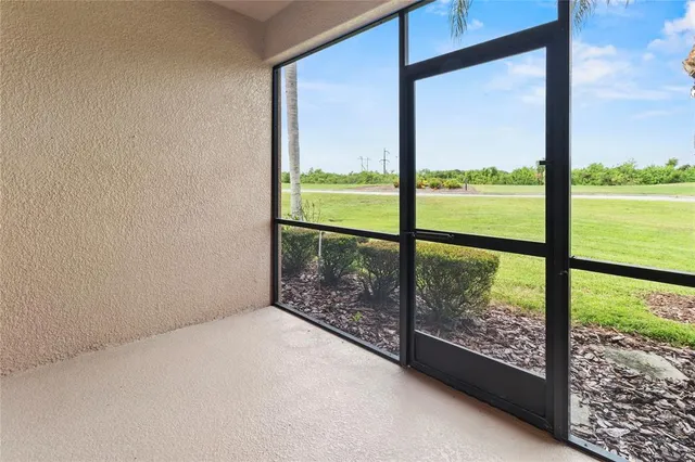 an aerial view of residential houses with outdoor space and river