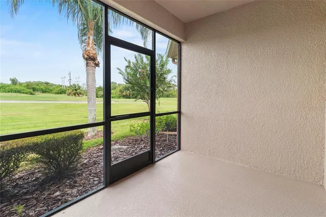 an outdoor living space with furniture and garden view