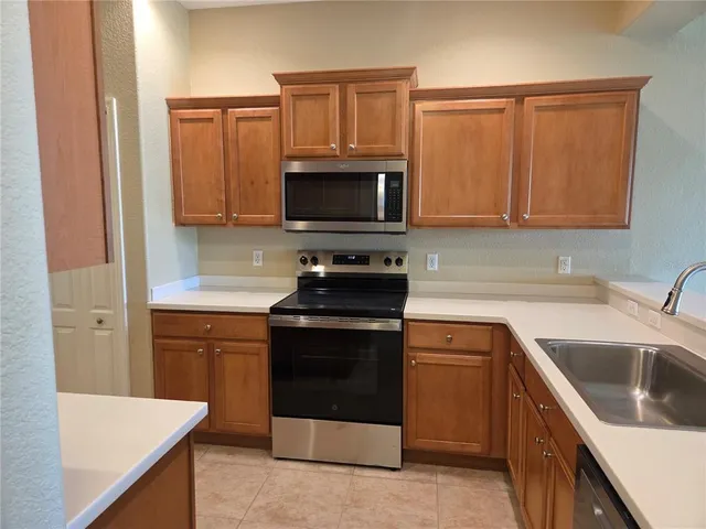 a view of an empty room with glass door