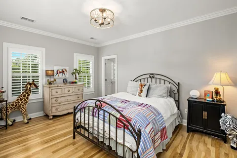 a bedroom with a bed and a table in it