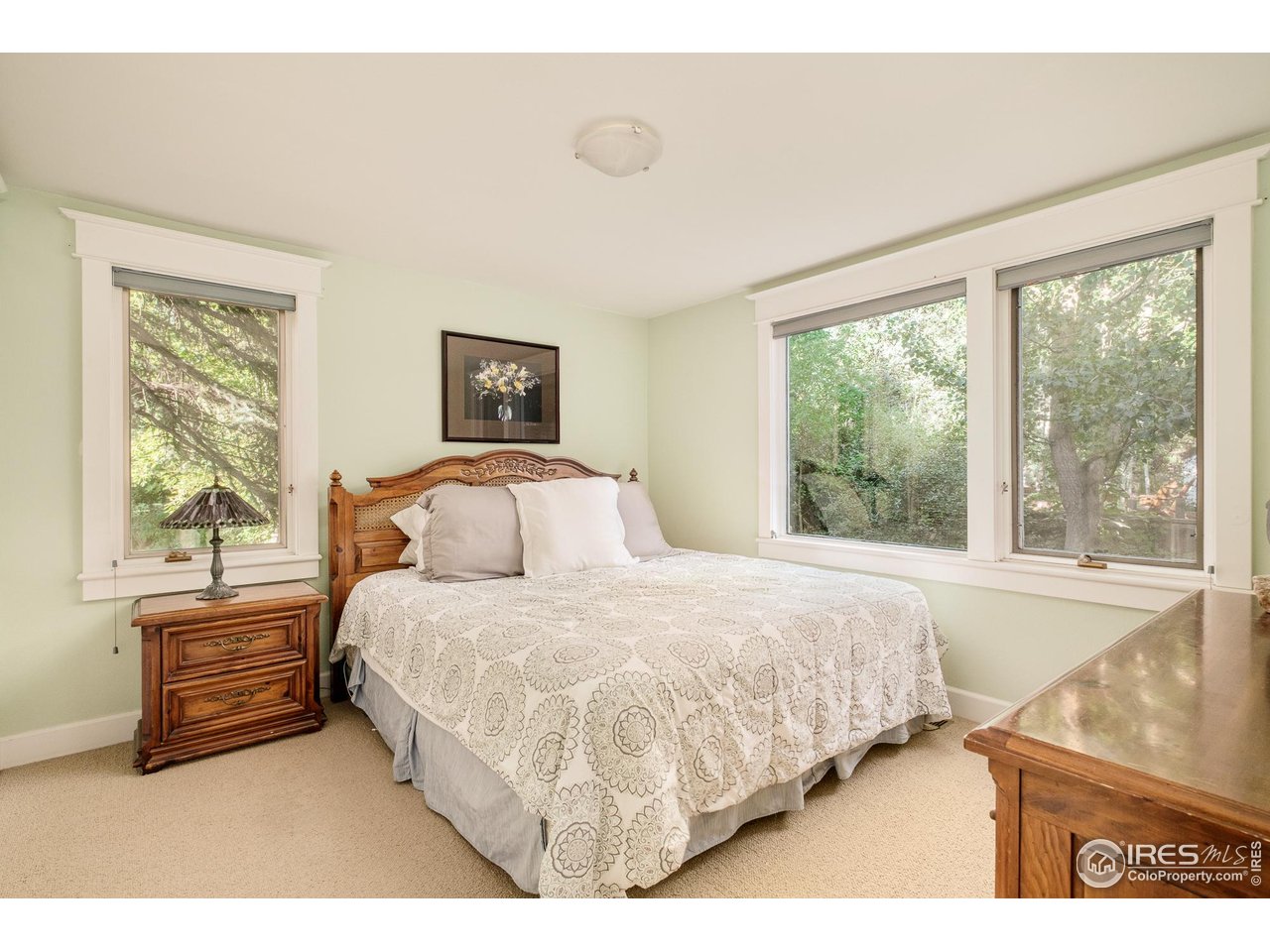 3788 26th Street Boulder, CO 80304 - Photo 21 of 47 a bedroom with a bed next to a window