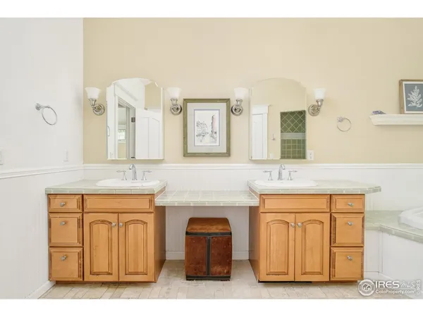 a bathroom with a sink a mirror and a vanity