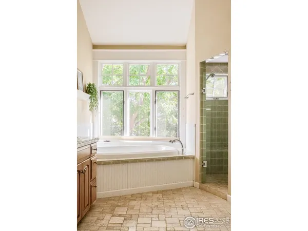 a bathroom with a bathtub and a vanity