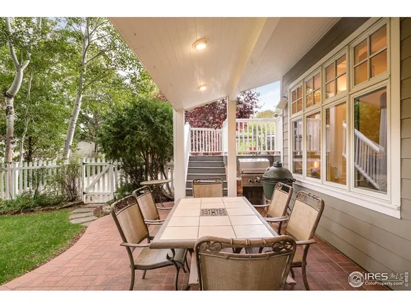 a view of a patio with table and chairs