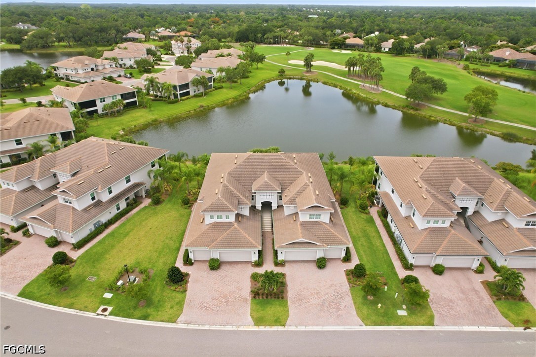 3751 Pebblebrook Ridge Court, Unit 101 Fort Myers, FL 33905 - Photo 48 of 48 an aerial view of a house with a lake view