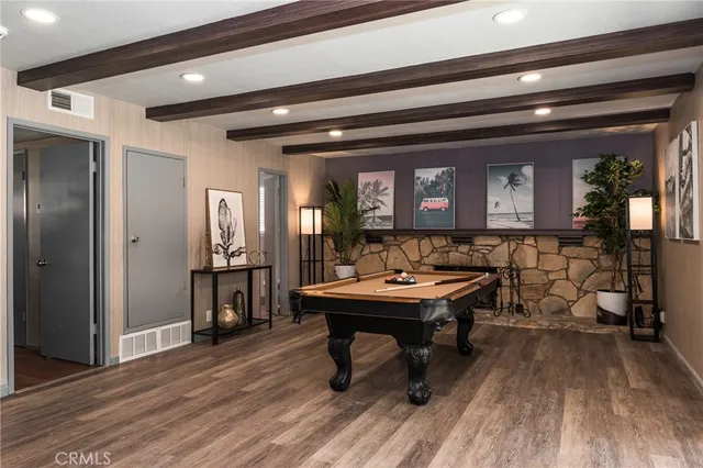 a view of a room that has a table and chairs in it