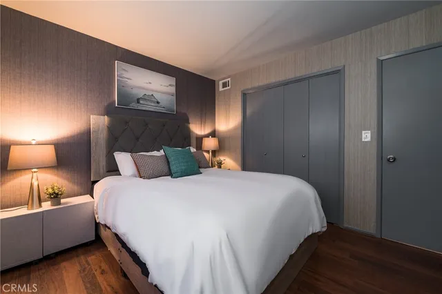 a bedroom with bed and window