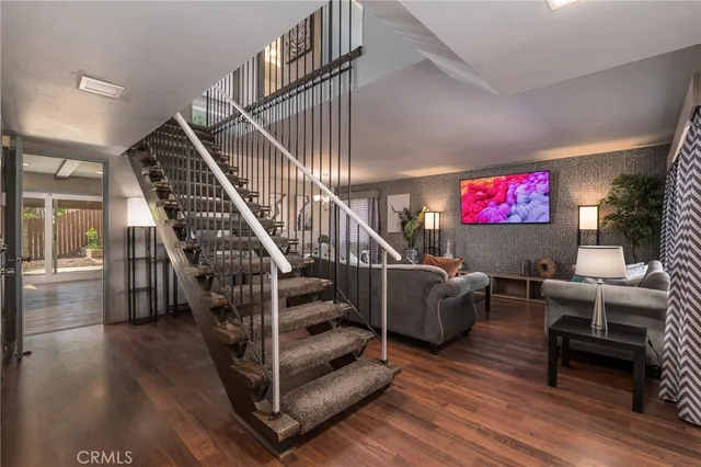 a view of entryway dining room and hall with wooden floor