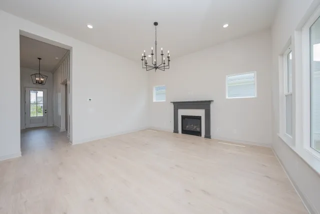 a kitchen with kitchen island a stove a sink a center island and cabinets