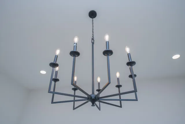 a kitchen with a sink a stove and cabinets