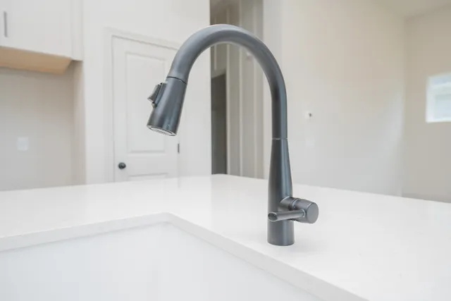 a spacious bedroom with a bed and a large window