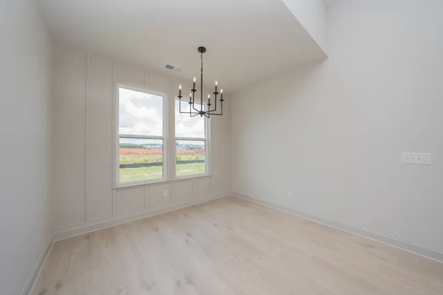 a view of a big room with closet and ceiling fan