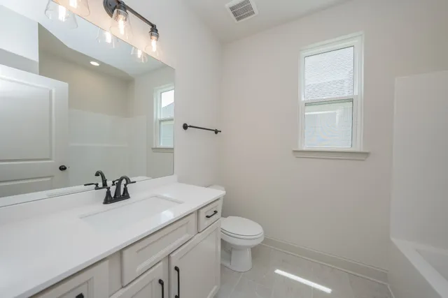 a close up of a sink with a mirror
