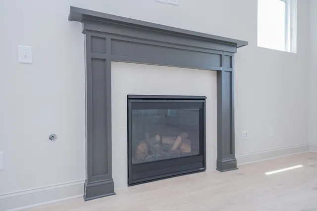 a kitchen with a table chairs stove and cabinets