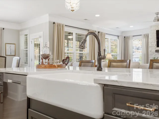 a view of living room with granite countertop furniture and a fireplace