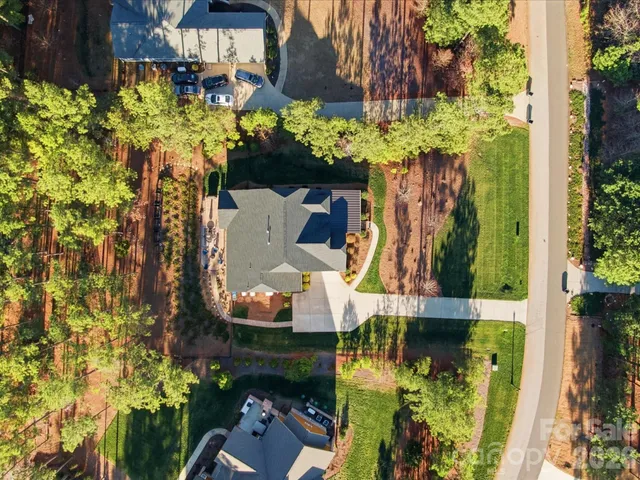 an aerial view of a house with a yard and garden