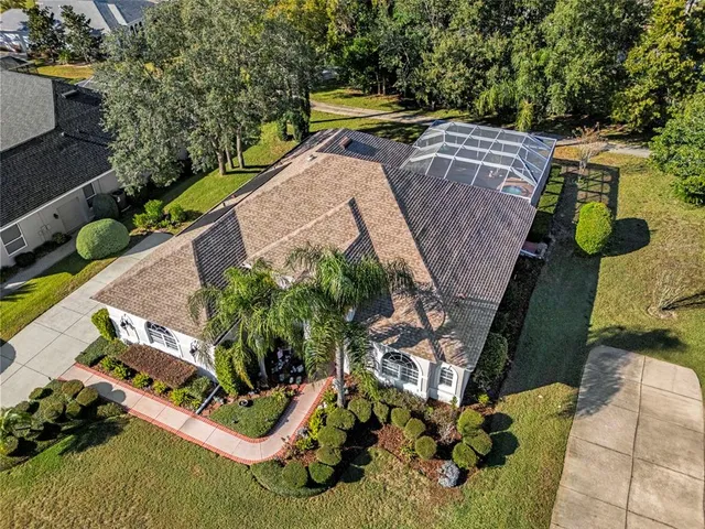 an aerial view of a house with outdoor space