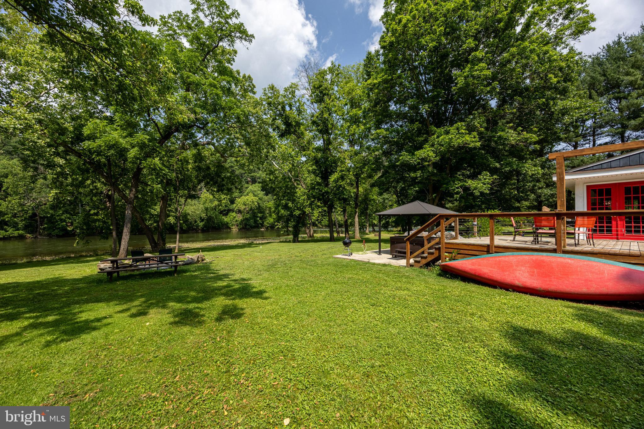 1215 Fort Stover Road Luray, VA 22835 - Photo 124 of 143 a view of a swimming pool with lawn chairs and a big yard