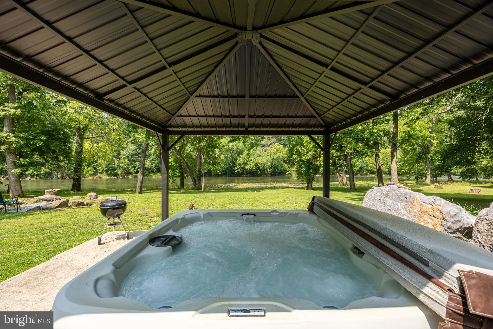1215 Fort Stover Road Luray, VA 22835 - Photo 127 of 143 a view of swimming pool with a table and chairs under an umbrella