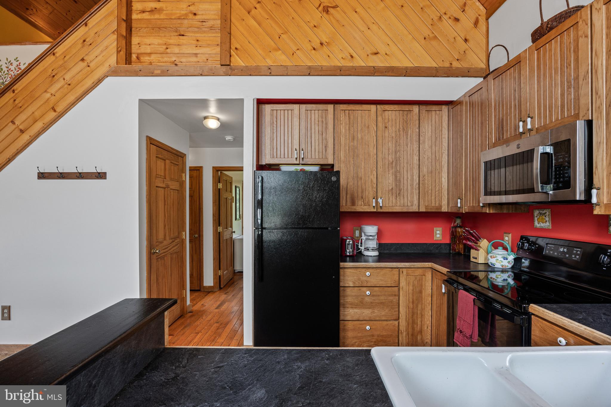 1215 Fort Stover Road Luray, VA 22835 - Photo 23 of 143 a kitchen with a refrigerator and a stove top oven