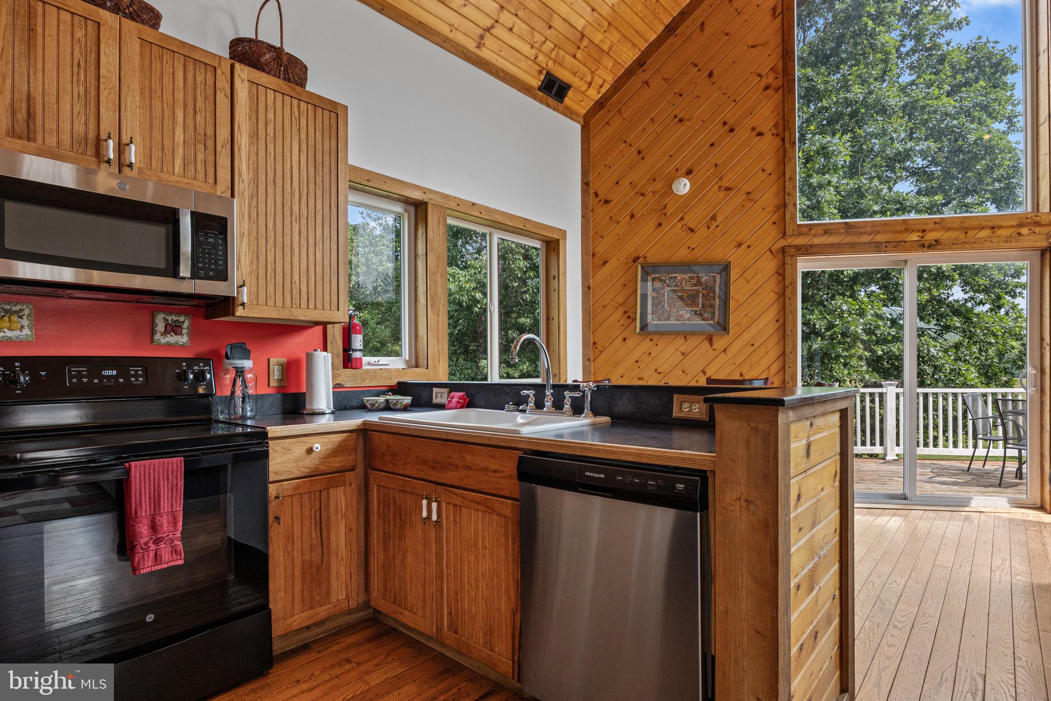1215 Fort Stover Road Luray, VA 22835 - Photo 27 of 143 a kitchen with stainless steel appliances granite countertop a stove a sink and a microwave