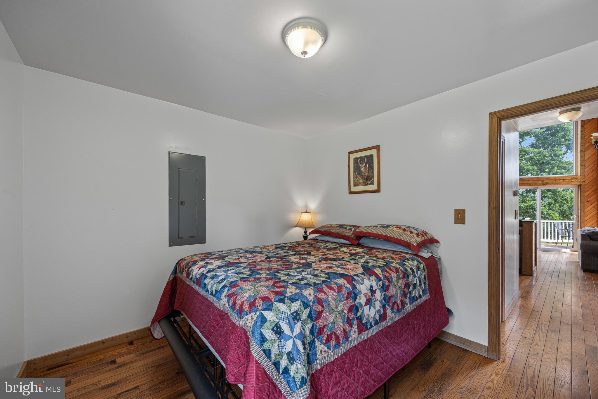 1215 Fort Stover Road Luray, VA 22835 - Photo 33 of 143 a bedroom with a bed and wooden floor