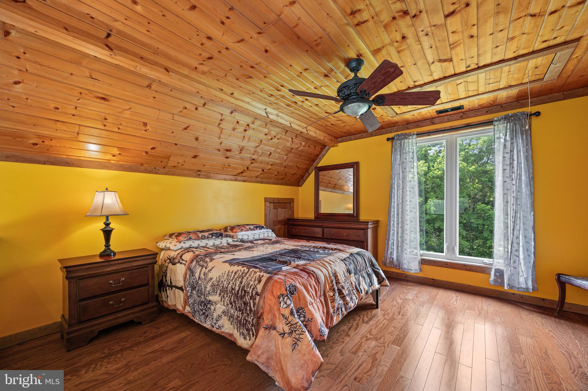 1215 Fort Stover Road Luray, VA 22835 - Photo 40 of 143 a bed sitting in a bedroom next to a window