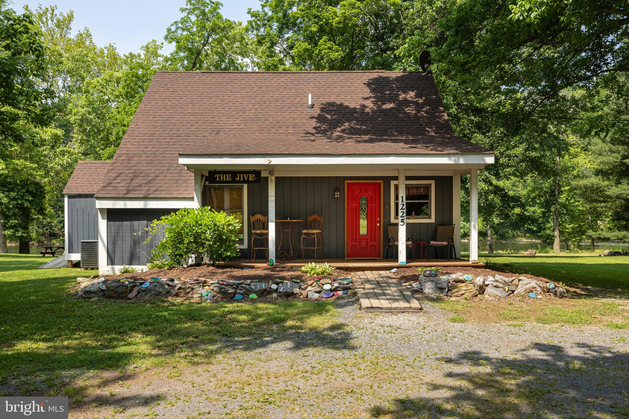 1215 Fort Stover Road Luray, VA 22835 - Photo 4 of 143 a front view of a house with a yard and garage