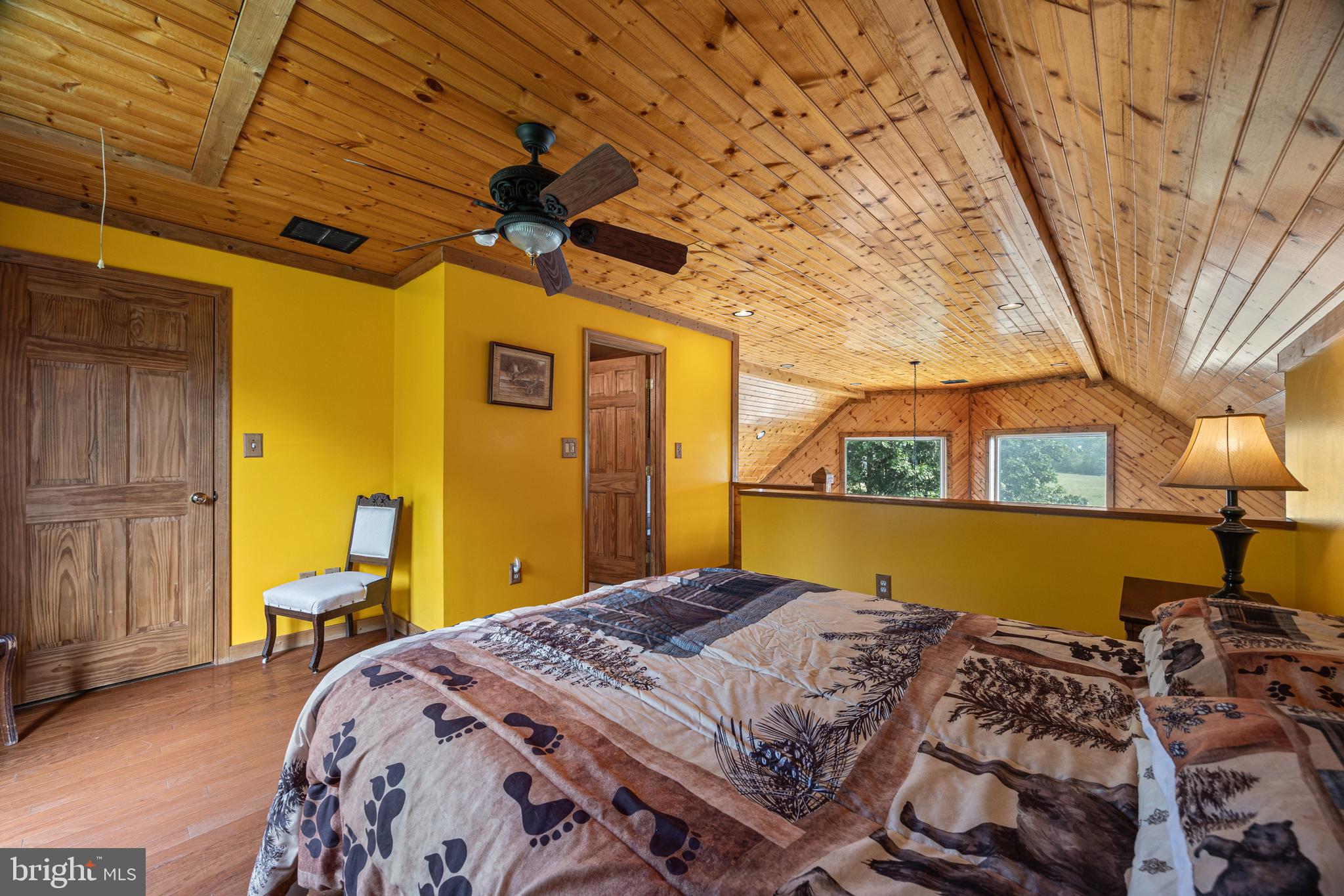 1215 Fort Stover Road Luray, VA 22835 - Photo 43 of 143 a bed sitting in a bedroom next to a window