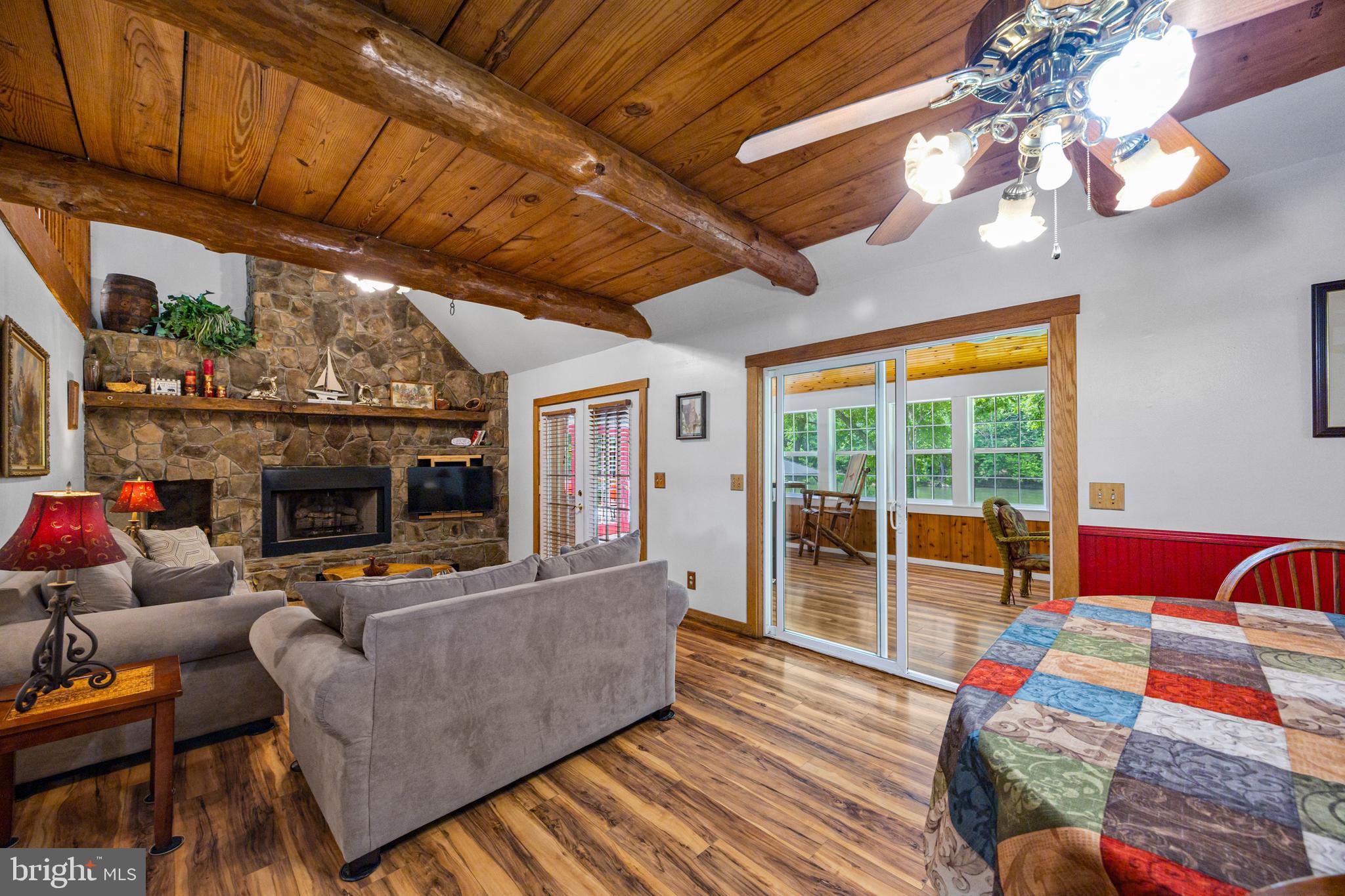 1215 Fort Stover Road Luray, VA 22835 - Photo 91 of 143 a living room with furniture a fireplace and next to a window