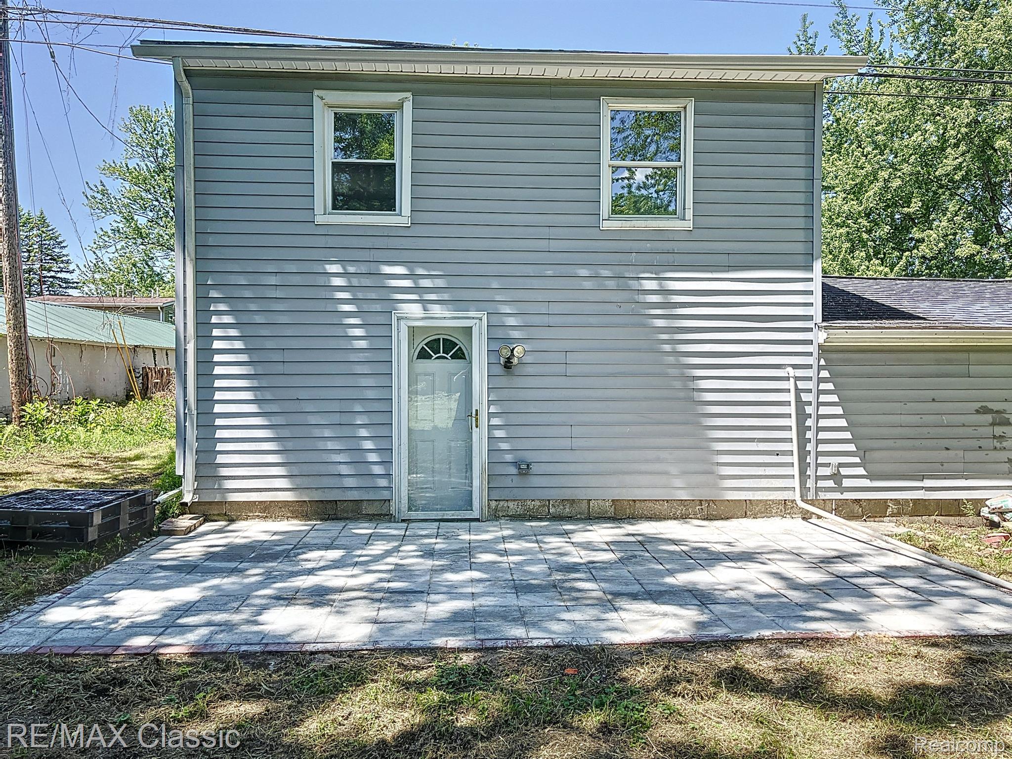 16587 Beech Daly Road Taylor, MI 48180 - Photo 43 of 47 Rear patio with entrance to the family room
