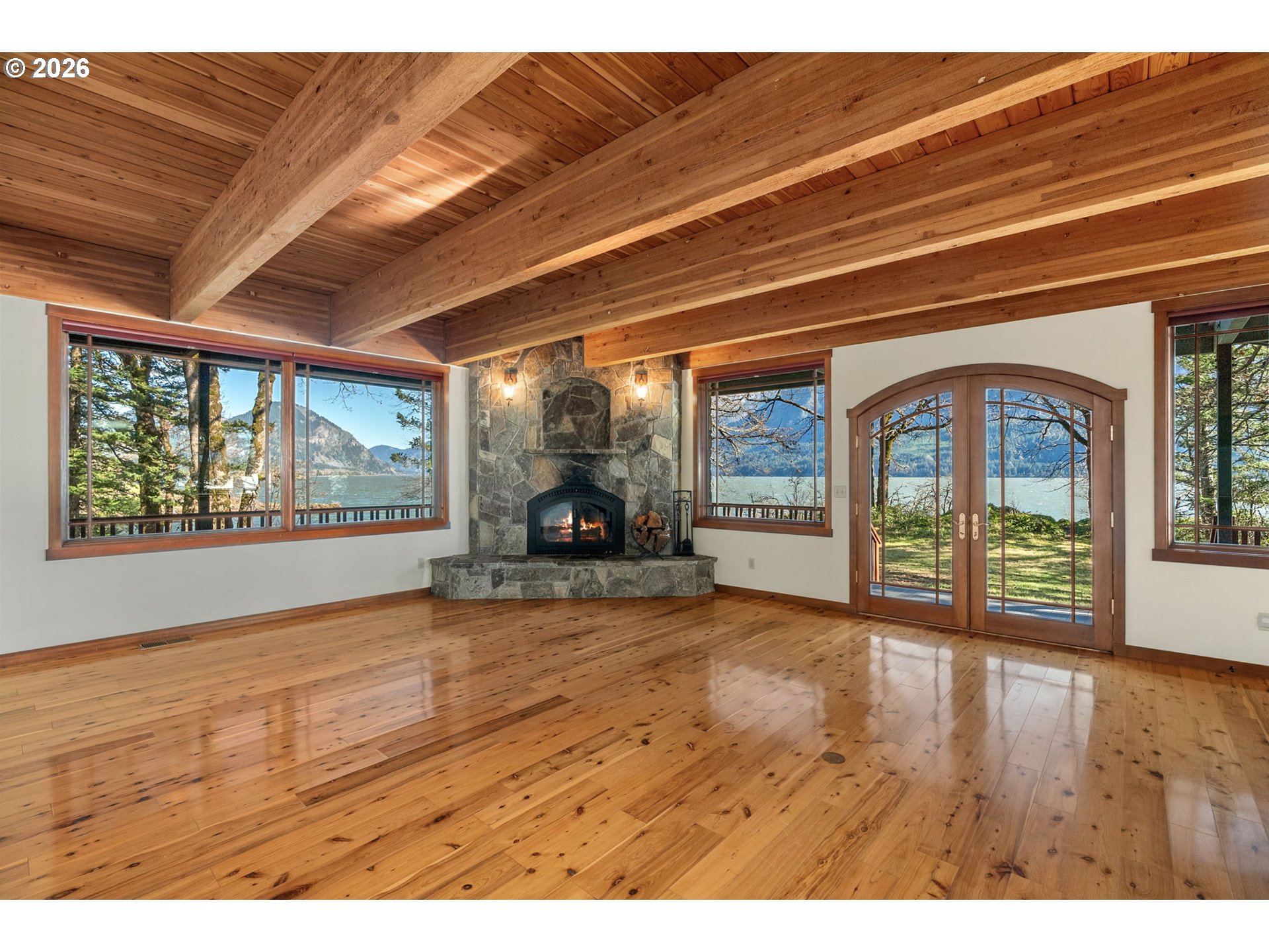 47742 Highway 14 Stevenson, WA 98648 - Photo 11 of 48 a view of an empty room with wooden floor and a window