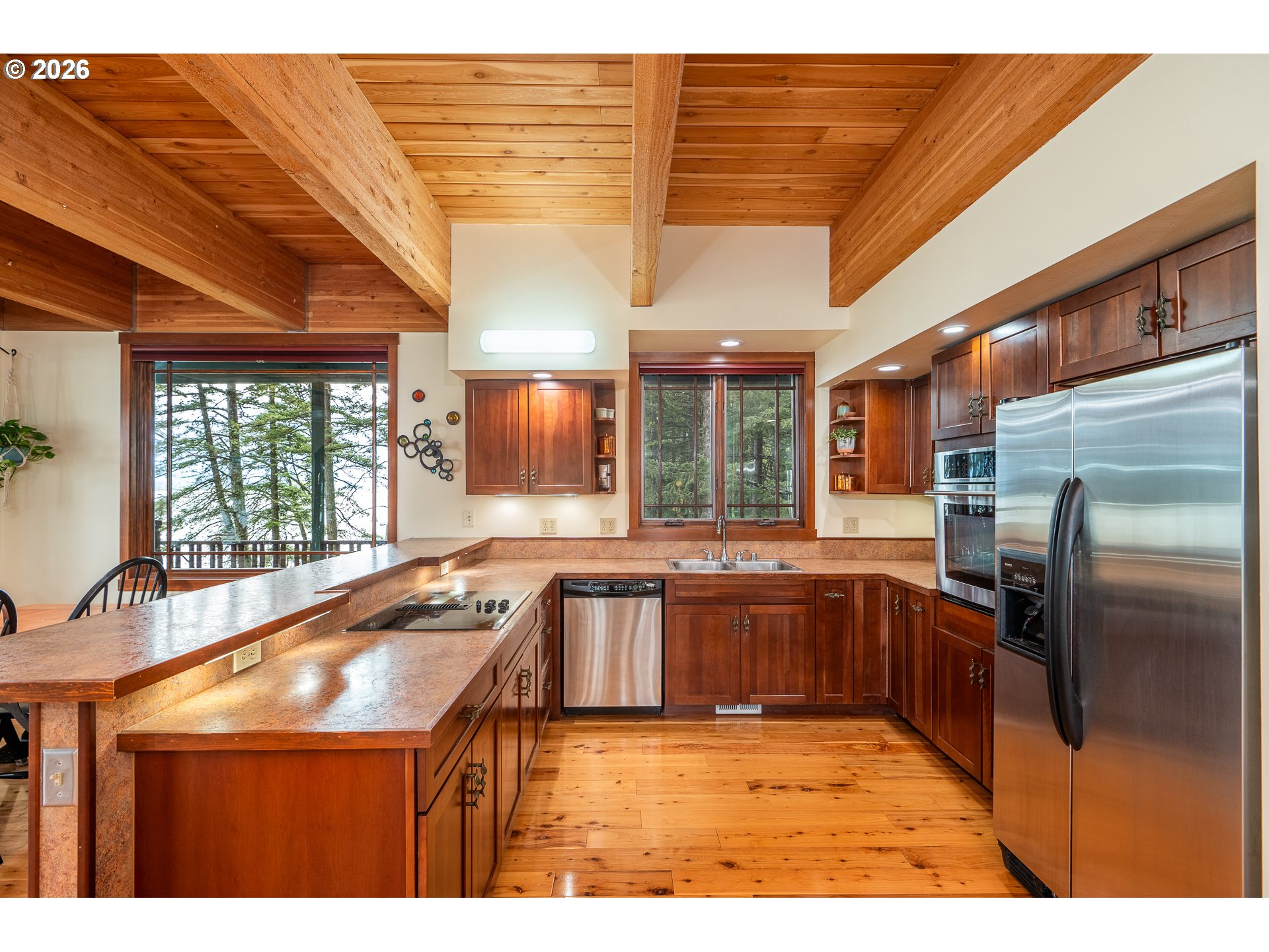 47742 Highway 14 Stevenson, WA 98648 - Photo 15 of 48 a kitchen with stainless steel appliances granite countertop a sink and cabinets