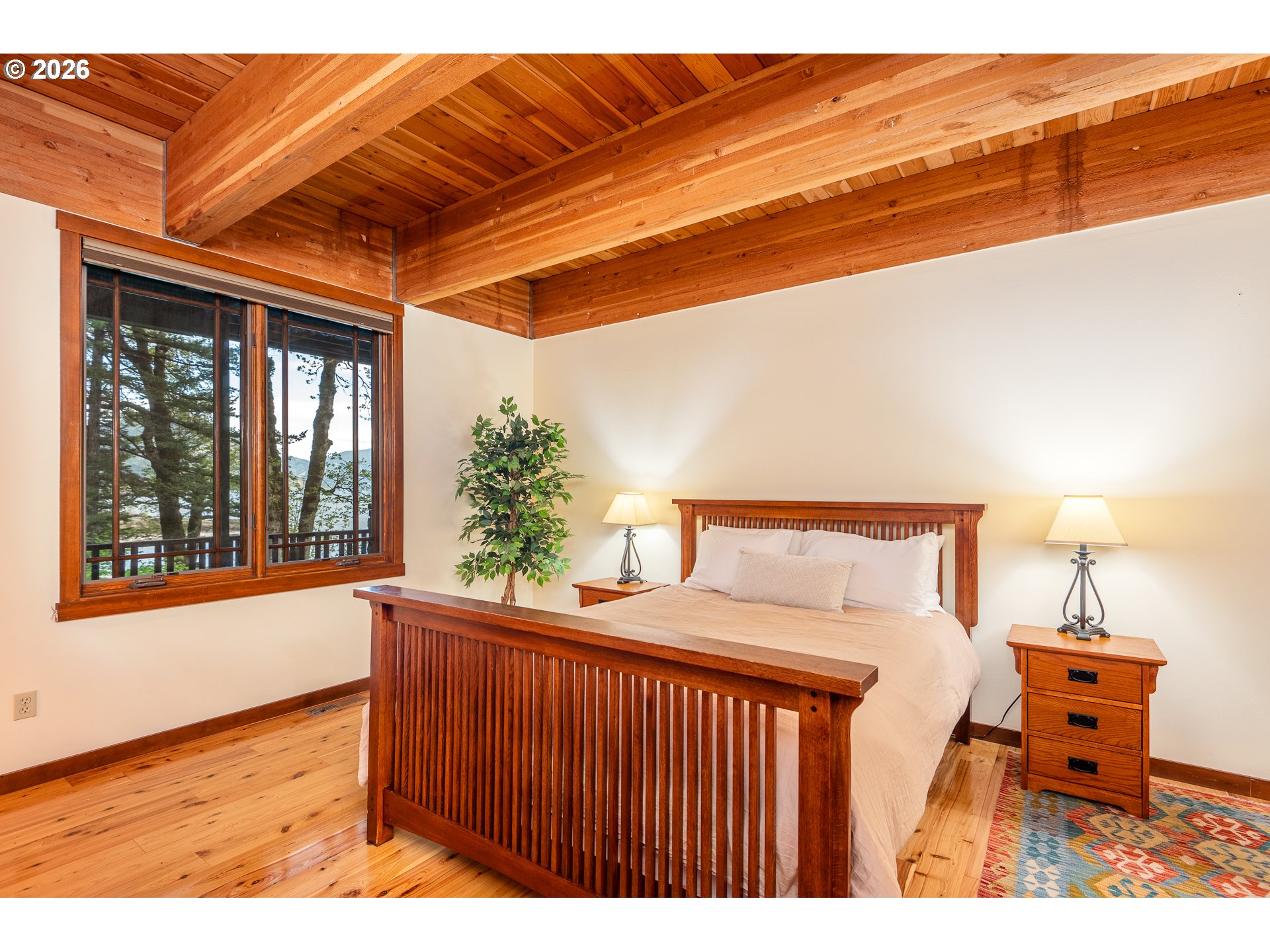 47742 Highway 14 Stevenson, WA 98648 - Photo 16 of 48 a bedroom with furniture and a window