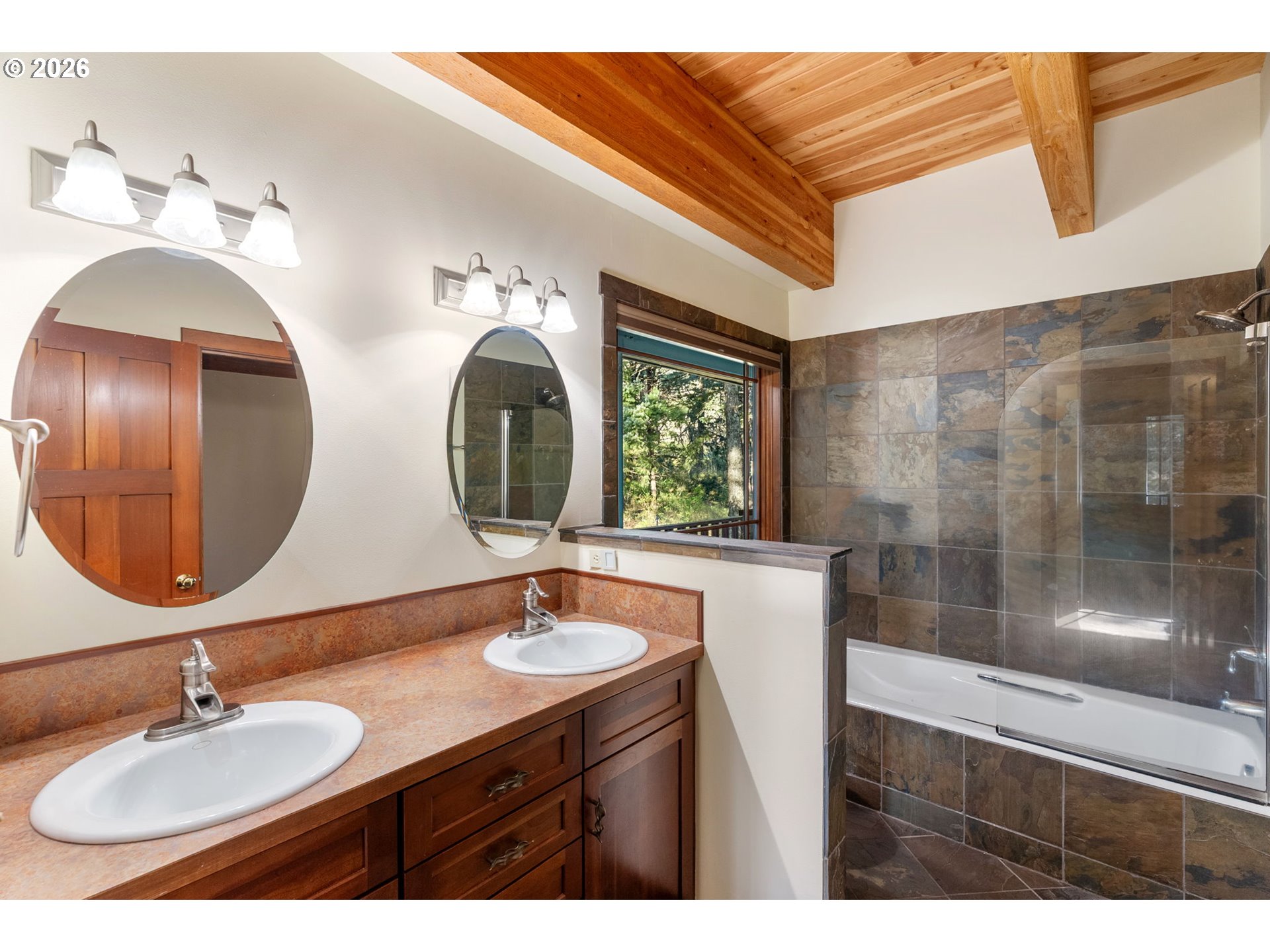 47742 Highway 14 Stevenson, WA 98648 - Photo 18 of 48 a bathroom with double vanity and a mirror