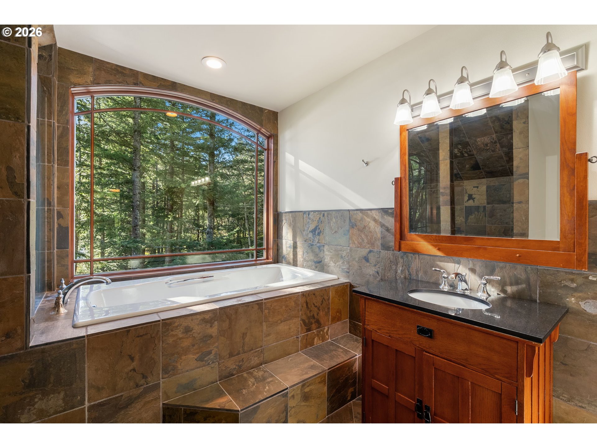 47742 Highway 14 Stevenson, WA 98648 - Photo 23 of 48 a bathroom with a sink bathtub and a large mirror
