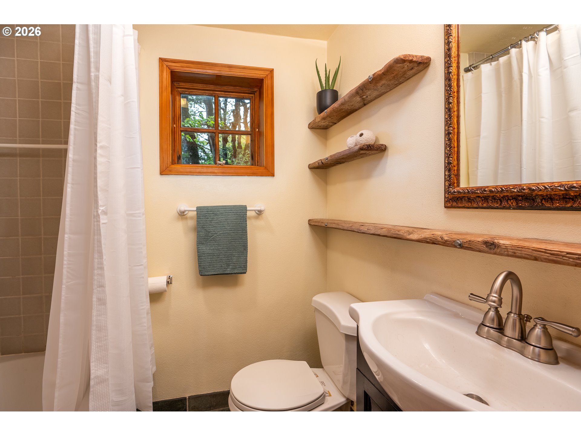 47742 Highway 14 Stevenson, WA 98648 - Photo 32 of 48 a bathroom with a toilet sink and mirror