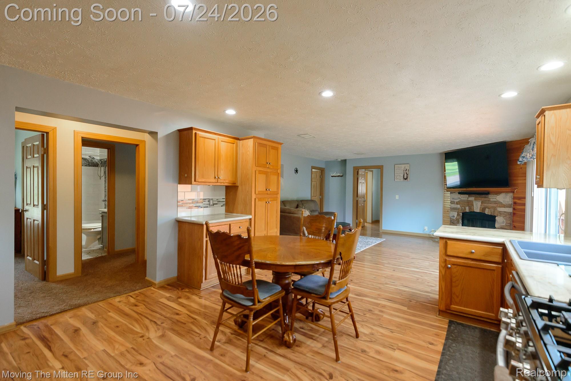 37460 Tyler Road Romulus, MI 48174 - Photo 14 of 52 Spacious common area featuring wood-finish flooring, recessed lighting, and light blue wall tones