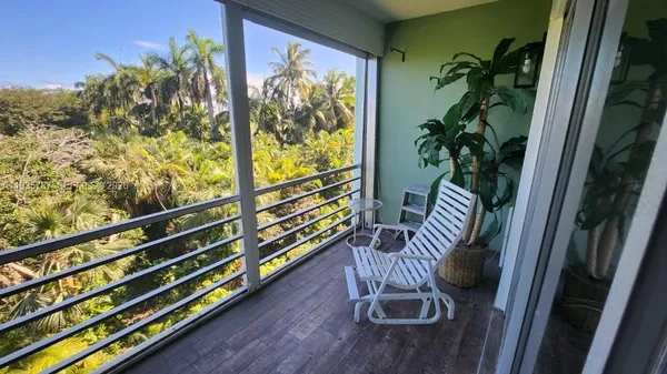 a view of balcony with furniture