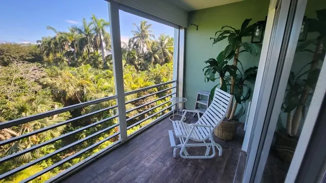 a view of balcony with furniture